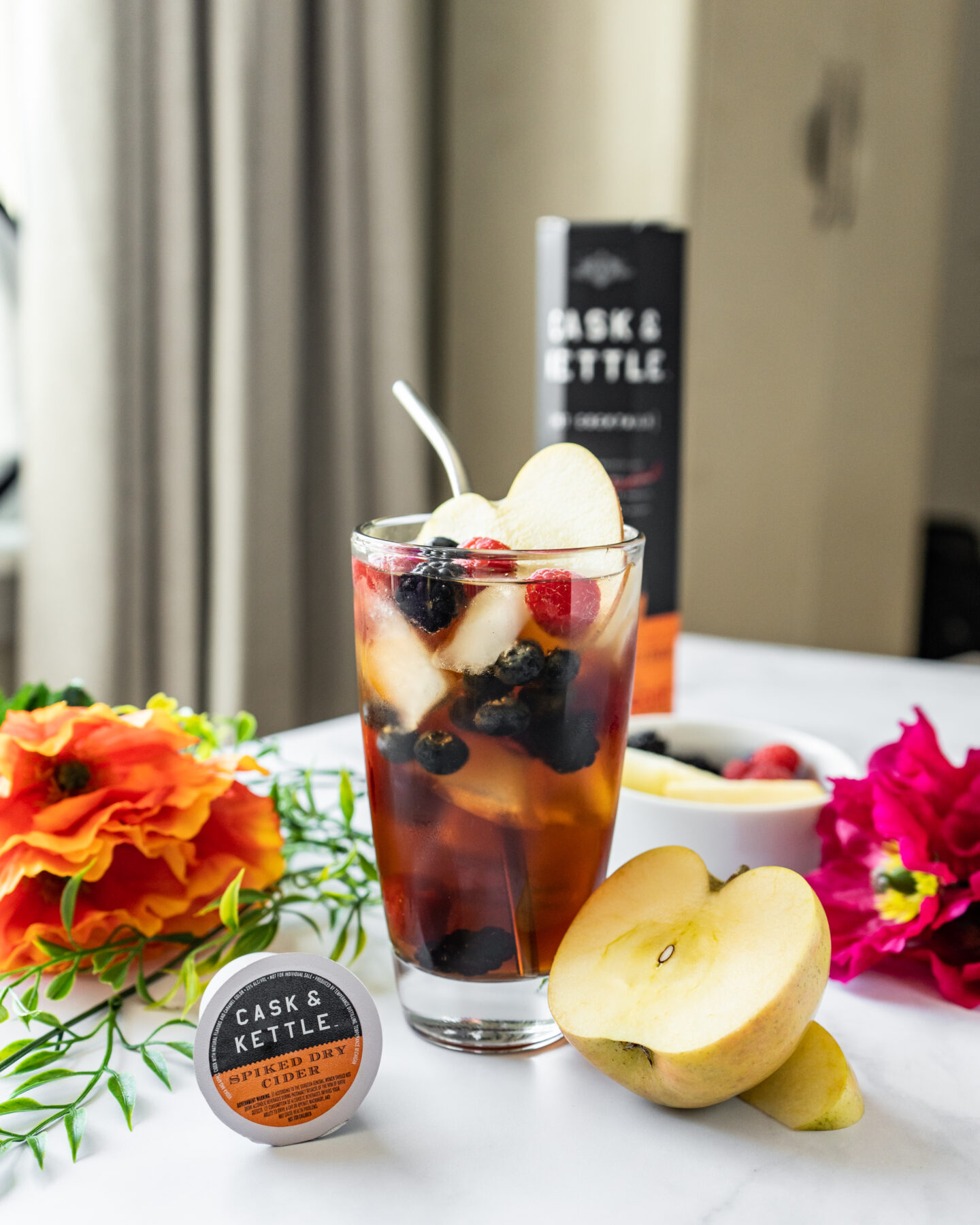 Spiked Cider Sangria Cocktail with flowers, apple, and K-Cup